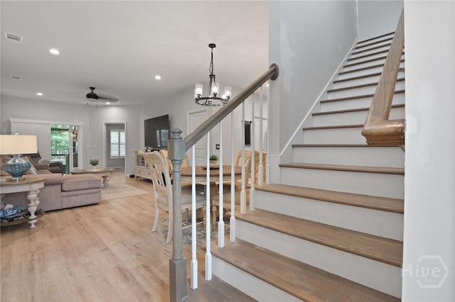 73 Small Pine Ln, Richmond Hill, GA 31324 - stairs with wood finished floors, recessed lighting, a chandelier, and ceiling fan