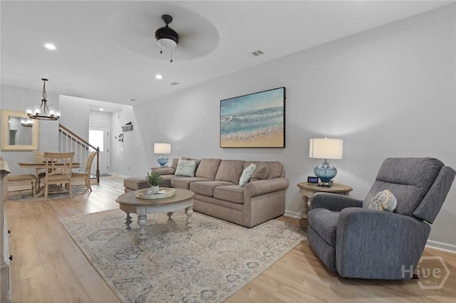 73 Small Pine Ln, Richmond Hill, GA 31324 - living room featuring a chandelier, light wood-style flooring, a ceiling fan, recessed lighting, and baseboards