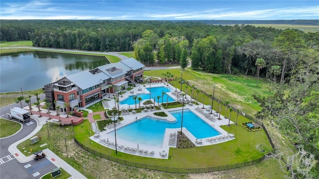 73 Small Pine Ln, Richmond Hill, GA 31324 - bird's eye view of a heavily wooded area, a pool, and a nearby body of water