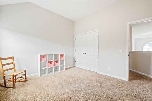 821 NE Mustang Ln, Ludowici, GA 31316 - unfurnished bedroom with carpet floors and lofted ceiling
