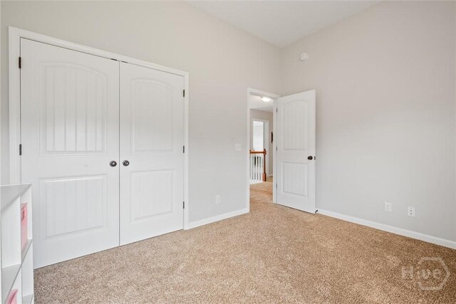 821 NE Mustang Ln, Ludowici, GA 31316 - unfurnished bedroom with carpet and a closet