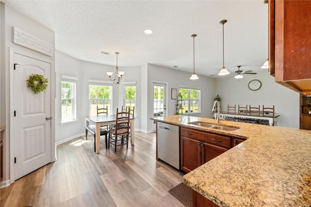 821 NE Mustang Ln, Ludowici, GA 31316 - kitchen with dishwasher, a sink, a chandelier, healthy amount of natural light, and recessed lighting