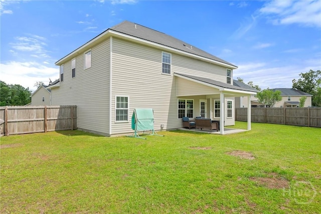 821 NE Mustang Ln, Ludowici, GA 31316 - rear view of property featuring a patio