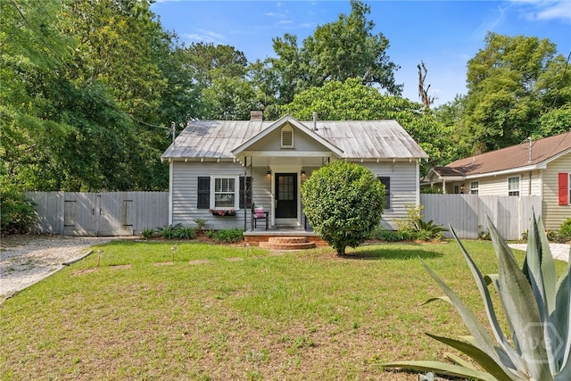 2609 Bismark Ave, Savannah, GA 31406 - bungalow with a gate, a chimney, and covered porch
