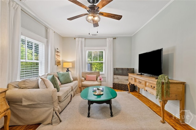 2609 Bismark Ave, Savannah, GA 31406 - living room with wood finished floors, ceiling fan, and crown molding