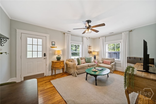 2609 Bismark Ave, Savannah, GA 31406 - living area featuring ceiling fan, light wood-type flooring, crown molding, and baseboards