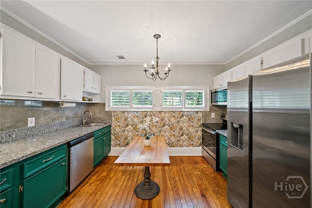 2609 Bismark Ave, Savannah, GA 31406 - kitchen featuring stainless steel appliances, green cabinetry, a sink, white cabinets, and a chandelier