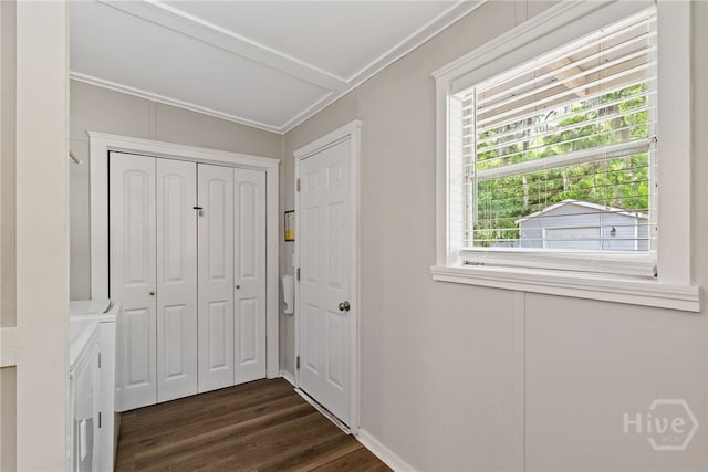 2609 Bismark Ave, Savannah, GA 31406 - hallway with separate washer and dryer, dark wood-style floors, baseboards, and crown molding
