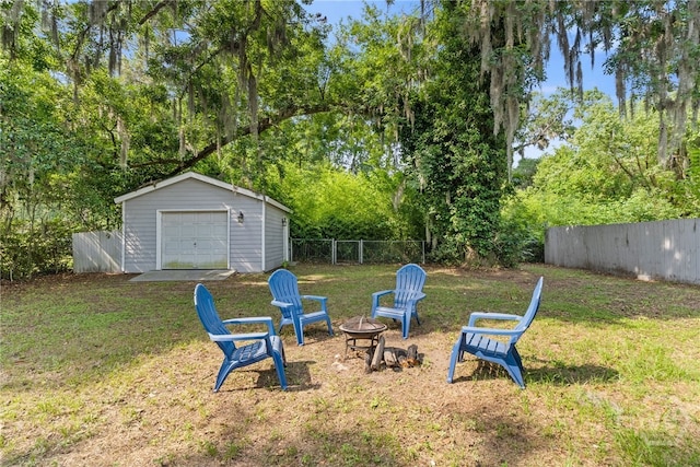 2609 Bismark Ave, Savannah, GA 31406 - view of yard with a fire pit, a detached garage, and an outdoor structure