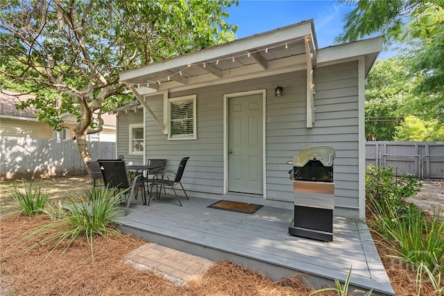 2609 Bismark Ave, Savannah, GA 31406 - rear view of house with a deck and outdoor dining area