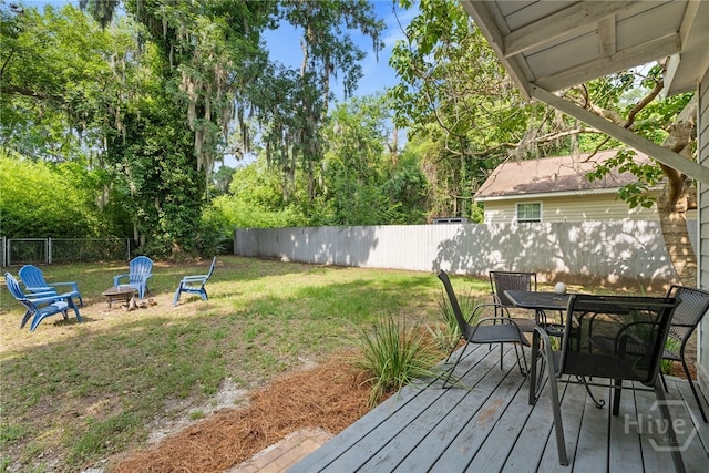 2609 Bismark Ave, Savannah, GA 31406 - wooden terrace with outdoor dining area and an outdoor fire pit
