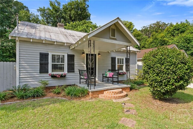 2609 Bismark Ave, Savannah, GA 31406 - bungalow featuring metal roof, a chimney, and a standing seam roof