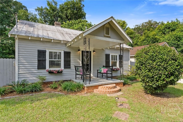 2609 Bismark Ave, Savannah, GA 31406 - bungalow-style house featuring a metal roof, a chimney, and a standing seam roof