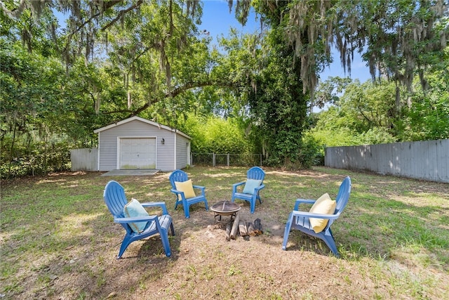 2609 Bismark Ave, Savannah, GA 31406 - view of yard with an outdoor fire pit, a garage, and an outbuilding