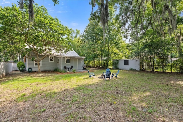 2609 Bismark Ave, Savannah, GA 31406 - view of yard featuring an outdoor fire pit and an outdoor structure