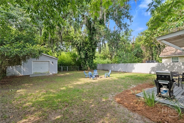 2609 Bismark Ave, Savannah, GA 31406 - view of yard with an outdoor fire pit, a garage, and an outbuilding