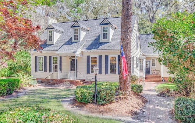 8720 Ferguson Ave, Savannah, GA 31406 - cape cod home with a chimney and roof with shingles