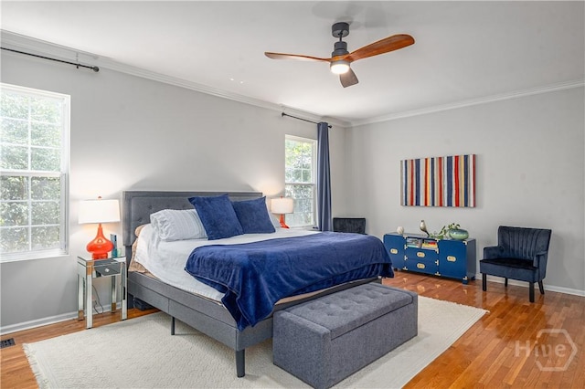 8720 Ferguson Ave, Savannah, GA 31406 - bedroom with wood finished floors, crown molding, baseboards, and ceiling fan
