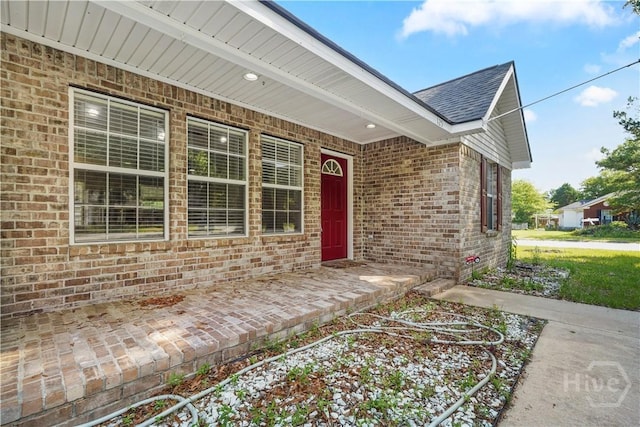 125 Crossing Cir, Rincon, GA 31326 - entrance to property featuring brick siding and roof with shingles