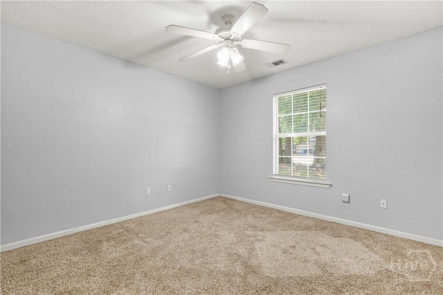 125 Crossing Cir, Rincon, GA 31326 - carpeted spare room featuring a ceiling fan, baseboards, and a textured ceiling