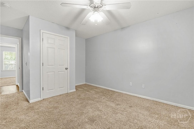125 Crossing Cir, Rincon, GA 31326 - unfurnished bedroom featuring carpet flooring, baseboards, and ceiling fan