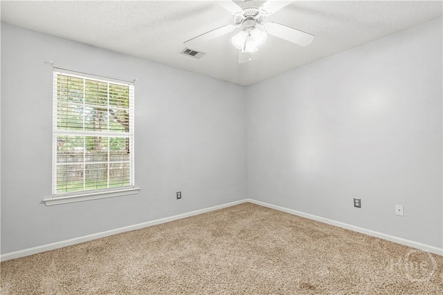125 Crossing Cir, Rincon, GA 31326 - spare room featuring carpet floors, baseboards, a ceiling fan, and a textured ceiling