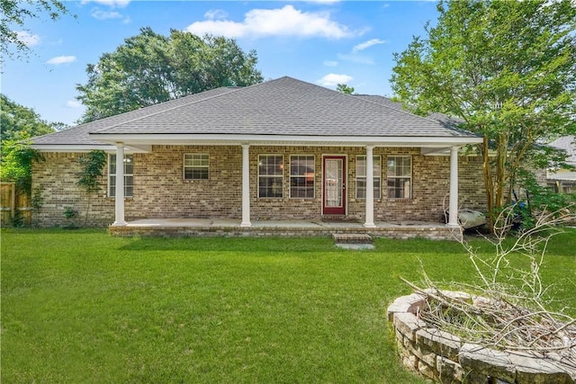125 Crossing Cir, Rincon, GA 31326 - back of property with a yard, brick siding, and a shingled roof