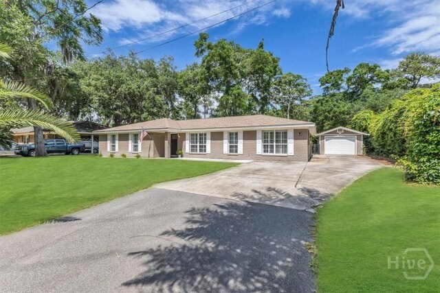 2 Penrose Pt, Savannah, GA 31410 - ranch-style home with driveway, an outdoor structure, a detached garage, and a front yard