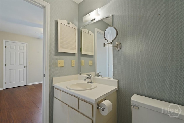 104 Bull River Bluff Dr Unit 104, Savannah, GA 31410 - half bath with vanity, hardwood / wood-style flooring, toilet, and baseboards