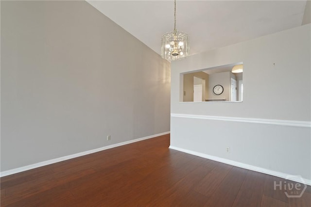 104 Bull River Bluff Dr Unit 104, Savannah, GA 31410 - empty room featuring a chandelier, baseboards, and dark wood-type flooring