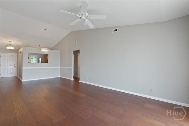 104 Bull River Bluff Dr Unit 104, Savannah, GA 31410 - unfurnished living room with lofted ceiling, ceiling fan, baseboards, dark wood-style flooring, and a chandelier