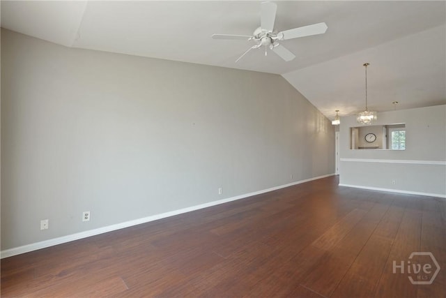 104 Bull River Bluff Dr Unit 104, Savannah, GA 31410 - unfurnished living room with dark wood finished floors, vaulted ceiling, baseboards, a chandelier, and a ceiling fan