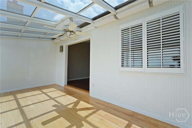 104 Bull River Bluff Dr Unit 104, Savannah, GA 31410 - spare room with a skylight, wood finished floors, baseboards, and ceiling fan