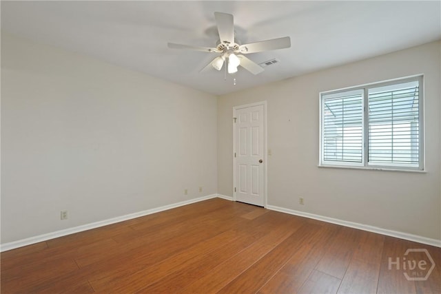 104 Bull River Bluff Dr Unit 104, Savannah, GA 31410 - empty room featuring baseboards, wood finished floors, and a ceiling fan