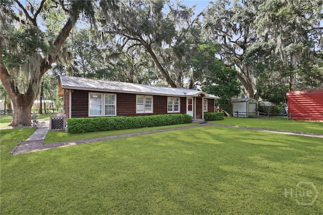 24 Mimosa St, Midway, GA 31320 - single story home with central air condition unit and metal roof