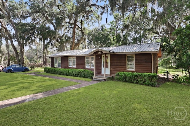 24 Mimosa St, Midway, GA 31320 - ranch-style house featuring metal roof
