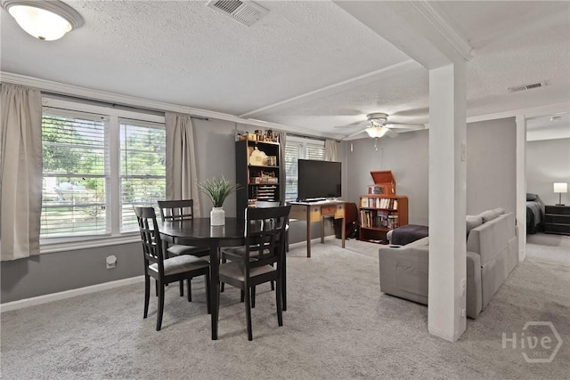 24 Mimosa St, Midway, GA 31320 - dining room featuring a textured ceiling, ceiling fan, light carpet, baseboards, and ornamental molding