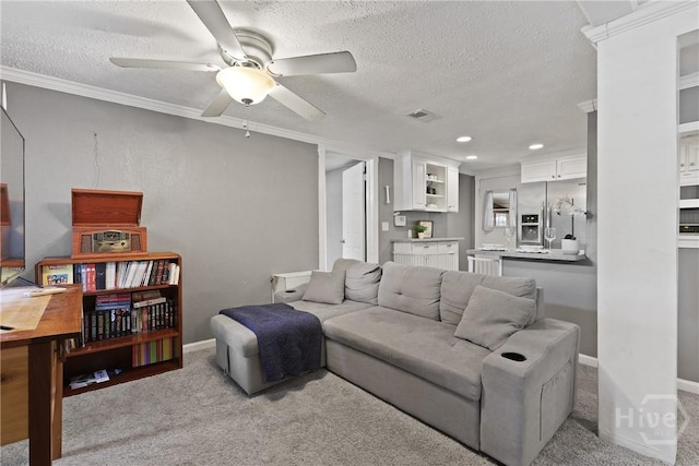 24 Mimosa St, Midway, GA 31320 - living room with a textured ceiling, a ceiling fan, light carpet, ornamental molding, and recessed lighting