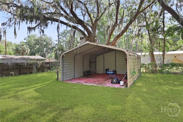 24 Mimosa St, Midway, GA 31320 - view of vehicle parking featuring a detached carport
