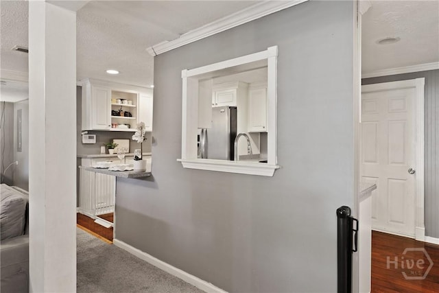 24 Mimosa St, Midway, GA 31320 - hall with crown molding, baseboards, and a textured ceiling