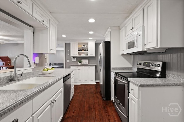 24 Mimosa St, Midway, GA 31320 - kitchen with appliances with stainless steel finishes, a sink, white cabinets, open shelves, and recessed lighting