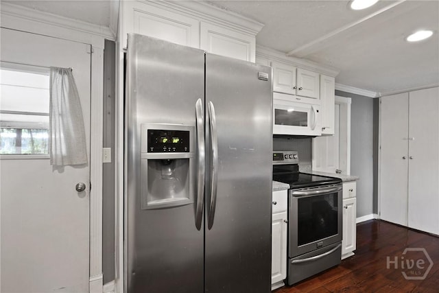 24 Mimosa St, Midway, GA 31320 - kitchen featuring stainless steel appliances, crown molding, white cabinetry, dark wood-type flooring, and light countertops