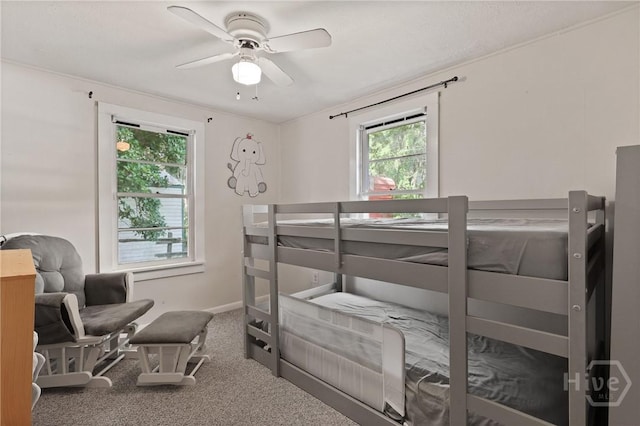 24 Mimosa St, Midway, GA 31320 - carpeted bedroom with baseboards and ceiling fan