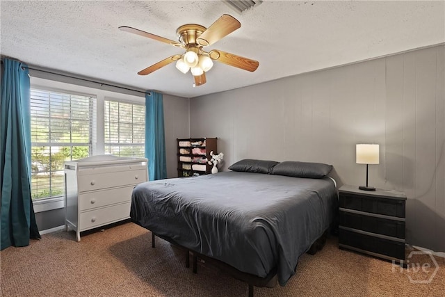 24 Mimosa St, Midway, GA 31320 - bedroom with carpet, a textured ceiling, and a ceiling fan