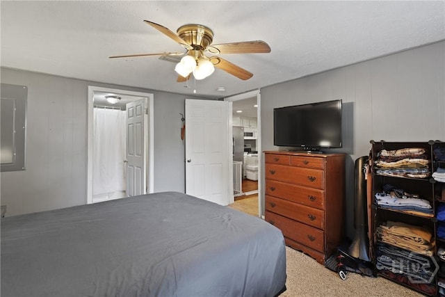 24 Mimosa St, Midway, GA 31320 - bedroom featuring electric panel, light colored carpet, a ceiling fan, and connected bathroom