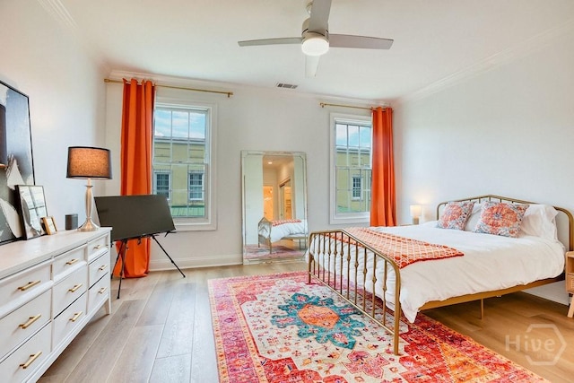 329 W Charlton St, Savannah, GA 31401 - bedroom featuring crown molding, light wood finished floors, baseboards, and a ceiling fan
