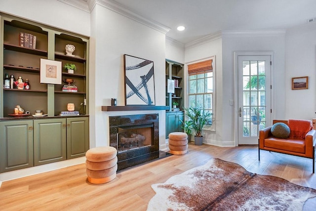 329 W Charlton St, Savannah, GA 31401 - sitting room featuring crown molding, wood finished floors, a fireplace, recessed lighting, and baseboards