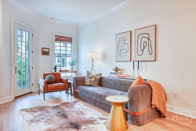329 W Charlton St, Savannah, GA 31401 - living area featuring crown molding, wood finished floors, and baseboards
