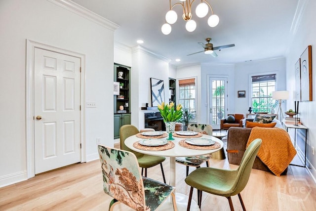 329 W Charlton St, Savannah, GA 31401 - dining area with ornamental molding, light wood-style flooring, a ceiling fan, and baseboards
