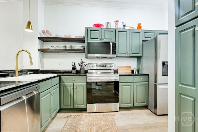 329 W Charlton St, Savannah, GA 31401 - kitchen with appliances with stainless steel finishes, green cabinetry, crown molding, open shelves, and dark countertops